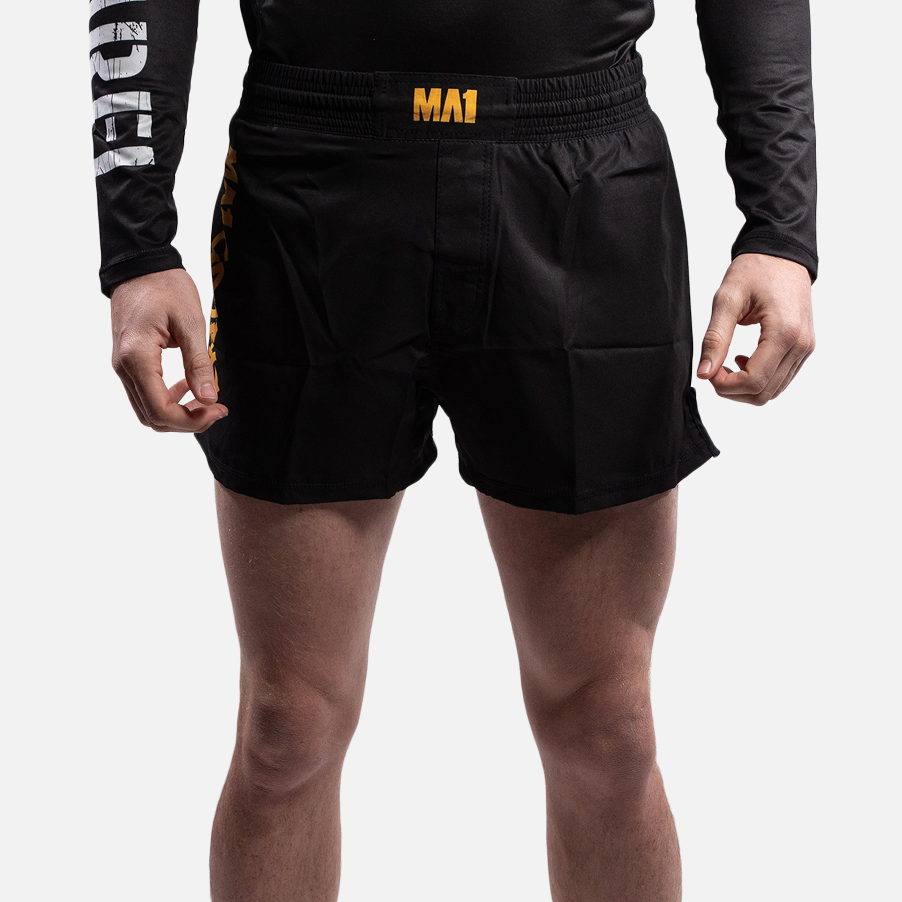 MA1 COMBAT BLACK AND GOLD MMA SHORTS